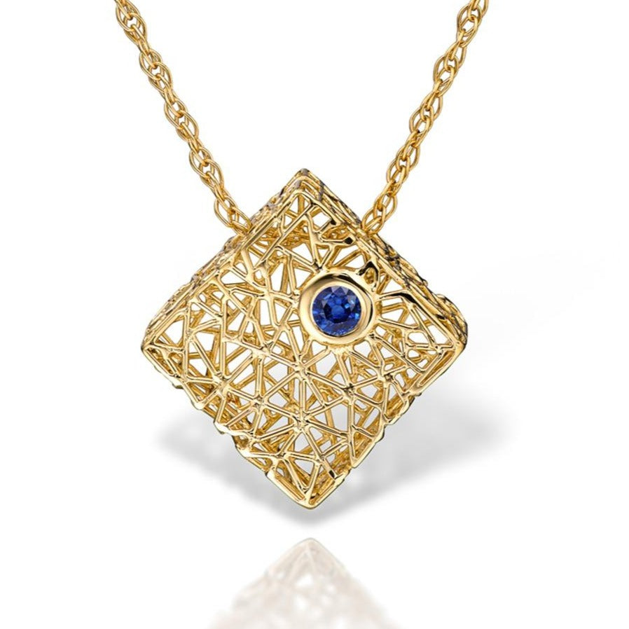 Gold box pendant with blue sapphire